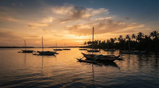 Outrigger boats moored in Negombo lagoon at sunset