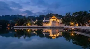 The Temple of the Tooth beside Kandy Lake at dusk